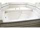 Luxurious bathtub with decorative tile under a large window at 861 Mcmurray Dr, Pahrump, NV 89060