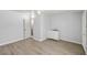 Large bedroom with light-colored wood floors, a utility sink, and white doors at 861 Mcmurray Dr, Pahrump, NV 89060