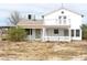 Exterior of a two-story house with white siding and a small balcony at 861 Mcmurray Dr, Pahrump, NV 89060