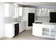 Bright kitchen with white cabinets, island, and stainless steel appliances at 861 Mcmurray Dr, Pahrump, NV 89060
