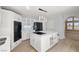 Bright, modern kitchen with white cabinets, a large island, and updated appliances at 861 Mcmurray Dr, Pahrump, NV 89060