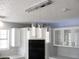 Modern kitchen with white cabinets and stainless steel appliances at 861 Mcmurray Dr, Pahrump, NV 89060