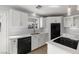 Renovated kitchen boasting white cabinets, new appliances, and modern countertops at 861 Mcmurray Dr, Pahrump, NV 89060