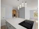 Kitchen island features cooktop and quartz countertop at 861 Mcmurray Dr, Pahrump, NV 89060