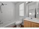 Bright bathroom featuring a shower-tub combination and wood vanity at 8789 Villa Alex Ave, Las Vegas, NV 89147