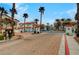 Gated community entrance with palm trees and well-maintained landscaping at 8789 Villa Alex Ave, Las Vegas, NV 89147
