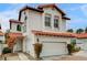 Beautiful two-story home showcasing a white exterior, red tile roof, and well-maintained front yard at 8789 Villa Alex Ave, Las Vegas, NV 89147