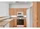 This kitchen offers neutral finishes, a gas range, microwave, and bright, natural lighting at 8789 Villa Alex Ave, Las Vegas, NV 89147