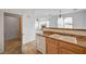 A view of the kitchen which includes the dishwasher, cabinetry and sink at 8789 Villa Alex Ave, Las Vegas, NV 89147