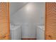 This laundry room features side-by-side machines and wood doors for added convenience at 8789 Villa Alex Ave, Las Vegas, NV 89147