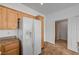 Adjacent to the kitchen is a laundry room with tile flooring and modern washer and dryer at 8789 Villa Alex Ave, Las Vegas, NV 89147