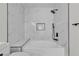 Modern bathroom featuring marble-style tile, matte black fixtures, and a built-in alcove at 950 Seven Hills Dr # 2418, Henderson, NV 89052