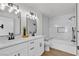 Modern bathroom with dual sinks, marble accents, and a soaking tub at 950 Seven Hills Dr # 2418, Henderson, NV 89052