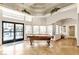 Bright game room featuring a pool table, large windows, and tile flooring at 950 Seven Hills Dr # 2418, Henderson, NV 89052