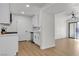 Bright kitchen with white cabinetry, stainless steel appliances, and wood-look flooring at 950 Seven Hills Dr # 2418, Henderson, NV 89052