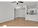 Spacious living room with wood-look floors flowing into a modern kitchen area at 950 Seven Hills Dr # 2418, Henderson, NV 89052