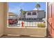 Property view from patio, showcasing parking area, well-maintained shrubs, and palm trees at 950 Seven Hills Dr # 2418, Henderson, NV 89052