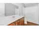 Bathroom featuring wood cabinet, tub, vanity, and stylish faucet at 9617 Sharp Horn Ct, Las Vegas, NV 89149