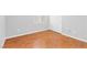A bright bedroom with wood floors, base trim and double door closet at 9617 Sharp Horn Ct, Las Vegas, NV 89149