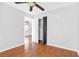 This bright bedroom features wood flooring, closet and ceiling fan at 9617 Sharp Horn Ct, Las Vegas, NV 89149