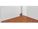Bright bedroom with wood floor, white base trim and interior door at 9617 Sharp Horn Ct, Las Vegas, NV 89149