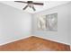 A bright bedroom features wood floors and a window with blinds at 9617 Sharp Horn Ct, Las Vegas, NV 89149