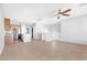 Bright, open-concept living area with tile floors, a ceiling fan, and plenty of natural light at 9617 Sharp Horn Ct, Las Vegas, NV 89149