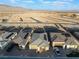 An aerial shot showcases a neighborhood with construction and single-Gathering homes against a desert backdrop at 10216 Chrysolite Pl, Las Vegas, NV 89143