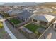 A high angle view showing a neighborhood house featuring a well-maintained lawn and outdoor living area at 10216 Chrysolite Pl, Las Vegas, NV 89143