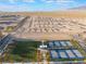 New community with an expansive recreation lawn, tennis courts, and walking paths surrounded by desert landscape at 10216 Chrysolite Pl, Las Vegas, NV 89143