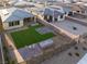 Spacious backyard featuring artificial turf, desert landscaping, and a modern design at 10216 Chrysolite Pl, Las Vegas, NV 89143