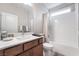 Clean bathroom with a modern vanity, bright lighting, and a shower-tub combination at 10216 Chrysolite Pl, Las Vegas, NV 89143