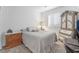 Cozy bedroom featuring a comfortable bed, natural light, and tasteful decor at 10216 Chrysolite Pl, Las Vegas, NV 89143