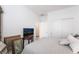 Well lit bedroom with carpet and featuring an armoire and closet at 10216 Chrysolite Pl, Las Vegas, NV 89143