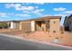 Charming single-story home with desert landscaping, brick driveway, and covered entry at 10216 Chrysolite Pl, Las Vegas, NV 89143