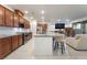 Open kitchen features granite countertops, stainless steel appliances, and island seating at 10216 Chrysolite Pl, Las Vegas, NV 89143