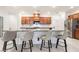 Kitchen featuring a large island with bar stool seating and modern cabinetry at 10216 Chrysolite Pl, Las Vegas, NV 89143