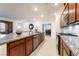 Spacious kitchen with a large granite island and modern stainless-steel appliances at 10216 Chrysolite Pl, Las Vegas, NV 89143