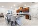 Open concept kitchen featuring a large island with bar stool seating and ample cabinetry at 10216 Chrysolite Pl, Las Vegas, NV 89143