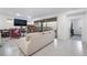 Spacious living room with tile floors and access to the backyard patio at 10216 Chrysolite Pl, Las Vegas, NV 89143