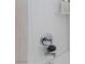 Close-up of a clean, white-tiled shower with modern fixtures at 10216 Chrysolite Pl, Las Vegas, NV 89143