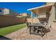 Enjoy outdoor dining on this covered patio with paved floors and a perfectly sized backyard at 10415 Andele Ave, Las Vegas, NV 89166