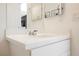 Bright bathroom featuring a modern vanity and chrome fixtures and decorative art at 10415 Andele Ave, Las Vegas, NV 89166