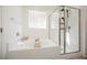 Bright bathroom with a tub and shower combination at 10415 Andele Ave, Las Vegas, NV 89166