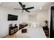 Bedroom with a ceiling fan, writing desk, and a wall-mounted television at 10415 Andele Ave, Las Vegas, NV 89166