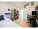 Bedroom featuring a cozy daybed, workstation and decorative shelving displaying personal items at 10415 Andele Ave, Las Vegas, NV 89166