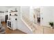 Bright entryway featuring a staircase, white doors, and stylish décor at 10415 Andele Ave, Las Vegas, NV 89166