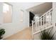 Bright foyer with modern wood floors leading to the living room and staircase at 10415 Andele Ave, Las Vegas, NV 89166