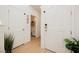 Bright home entryway with a glimpse of the bathroom and modern decor at 10415 Andele Ave, Las Vegas, NV 89166