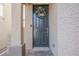 Close up of the front door with wreath and brick walkway at 10415 Andele Ave, Las Vegas, NV 89166